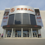 Regal theater entrance showcasing modern architecture and branding, relevant to Oratso Corp's door and window solutions for commercial spaces.