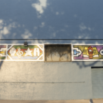 Mural depicting cultural symbols and artistic elements on a building exterior, related to Oratso Corp's focus on cultural art centers.